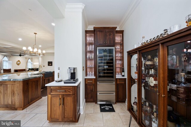 913A Caroline St, Fredericksburg, VA 22401 - kitchen featuring a peninsula, a chandelier, crown molding, light tile patterned flooring, and beverage cooler