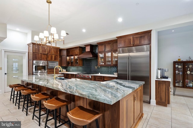 913A Caroline St, Fredericksburg, VA 22401 - kitchen featuring custom exhaust hood, built in appliances, backsplash, light tile patterned flooring, and recessed lighting