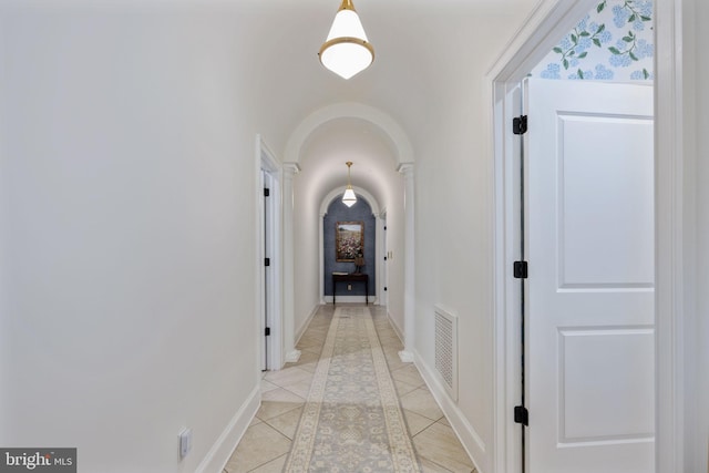 913A Caroline St, Fredericksburg, VA 22401 - corridor featuring arched walkways, light tile patterned floors, and baseboards