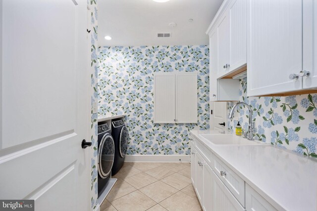 913A Caroline St, Fredericksburg, VA 22401 - laundry room featuring wallpapered walls, washing machine and dryer, cabinet space, baseboards, and light tile patterned floors