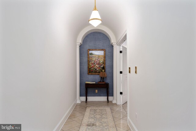 913A Caroline St, Fredericksburg, VA 22401 - corridor with decorative columns, light tile patterned floors, baseboards, and arched walkways