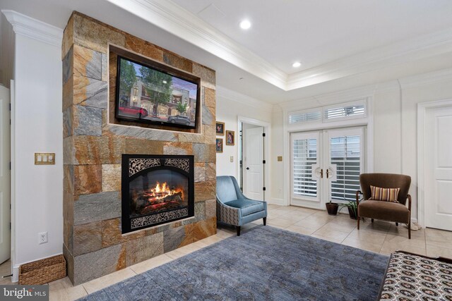 913A Caroline St, Fredericksburg, VA 22401 - living area featuring ornamental molding, a tiled fireplace, tile patterned flooring, recessed lighting, and french doors