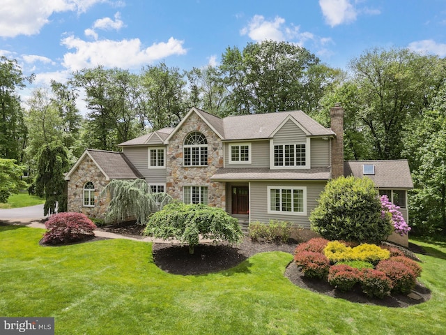 2 Turnberry Way, New Hope, PA 18938 - traditional-style home featuring stone siding, a front yard, and a chimney