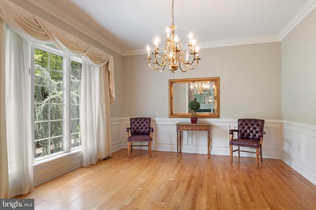 2 Turnberry Way, New Hope, PA 18938 - sitting room featuring healthy amount of natural light, a chandelier, light wood-type flooring, crown molding, and wainscoting