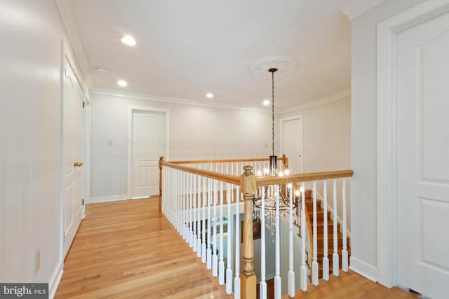 2 Turnberry Way, New Hope, PA 18938 - hallway featuring a chandelier, wood finished floors, crown molding, recessed lighting, and an upstairs landing