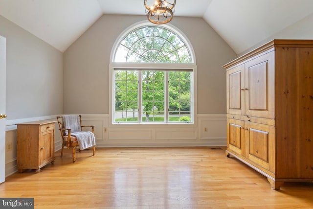 2 Turnberry Way, New Hope, PA 18938 - unfurnished room featuring plenty of natural light, a chandelier, light wood-style floors, lofted ceiling, and a wainscoted wall