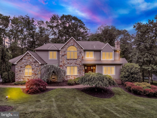 2 Turnberry Way, New Hope, PA 18938 - traditional home with stone siding, a chimney, a front yard, and a shingled roof