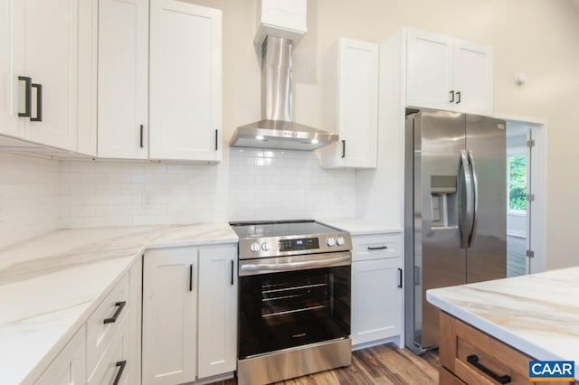 205 League Ln, Lovingston, VA 22949 - kitchen featuring stainless steel appliances, wall chimney exhaust hood, decorative backsplash, and light stone counters