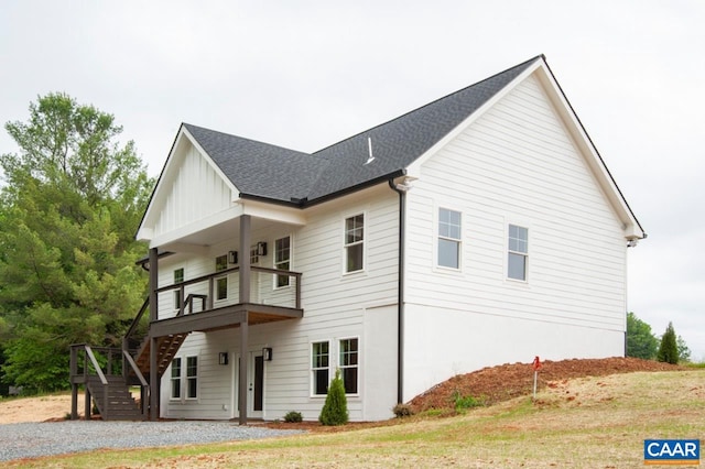 205 League Ln, Lovingston, VA 22949 - view of side of home featuring stairway, a shingled roof, board and batten siding, and a balcony