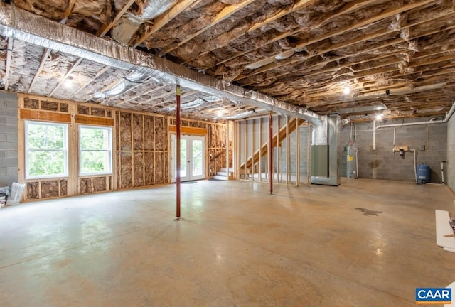 205 League Ln, Lovingston, VA 22949 - basement with heating unit, water heater, a water pressure tank, and french doors