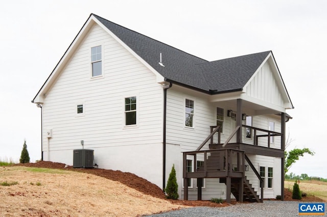 205 League Ln, Lovingston, VA 22949 - view of side of home with stairway, cooling unit, board and batten siding, and roof with shingles