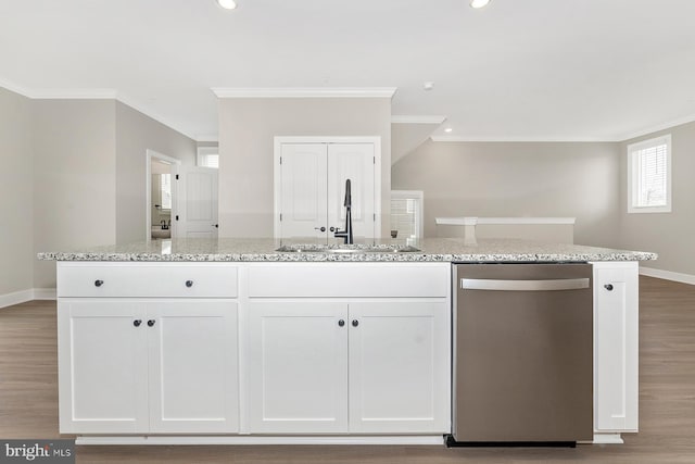 kitchen featuring stainless steel dishwasher, a sink, ornamental molding, white cabinetry, and recessed lighting