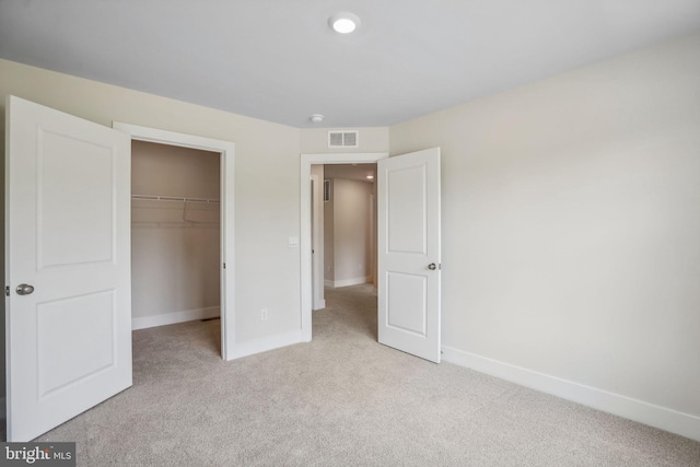 826 Long Meadow Dr, Fredericksburg, VA 22406 - unfurnished bedroom featuring light colored carpet, baseboards, a spacious closet, and a closet