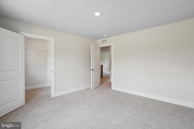 826 Long Meadow Dr, Fredericksburg, VA 22406 - unfurnished bedroom with carpet floors, baseboards, a spacious closet, and a closet