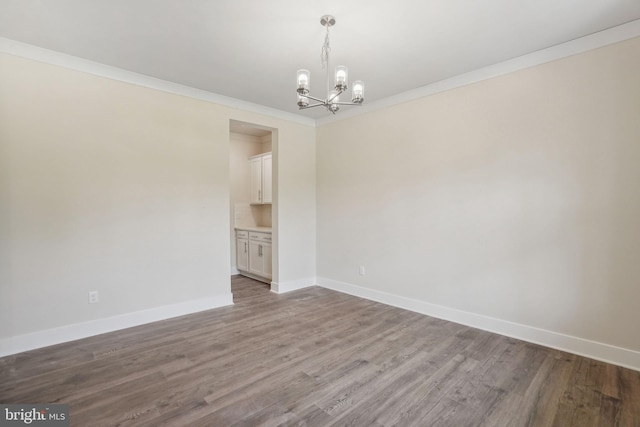 826 Long Meadow Dr, Fredericksburg, VA 22406 - unfurnished room with a chandelier, wood finished floors, baseboards, and ornamental molding