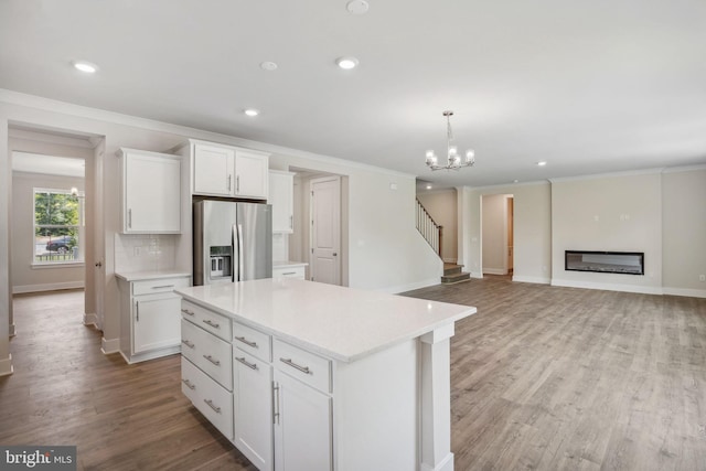 826 Long Meadow Dr, Fredericksburg, VA 22406 - kitchen featuring stainless steel refrigerator with ice dispenser, crown molding, white cabinets, light countertops, and recessed lighting