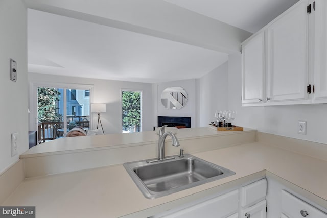6190 Little Valley Way, Alexandria, VA 22310 - kitchen featuring a sink, light countertops, white cabinetry, and open floor plan
