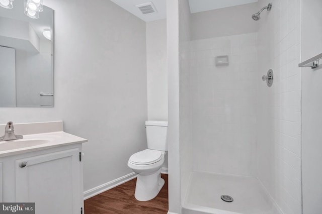 6190 Little Valley Way, Alexandria, VA 22310 - full bathroom featuring toilet, wood finished floors, vanity, a tile shower, and baseboards