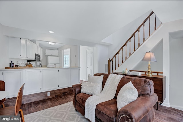 6190 Little Valley Way, Alexandria, VA 22310 - living room featuring wood finished floors, stairs, recessed lighting, and baseboards