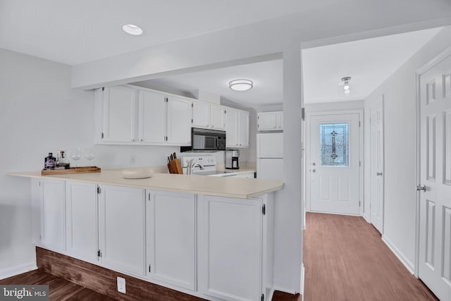 6190 Little Valley Way, Alexandria, VA 22310 - kitchen featuring black microwave, freestanding refrigerator, light countertops, wood finished floors, and baseboards