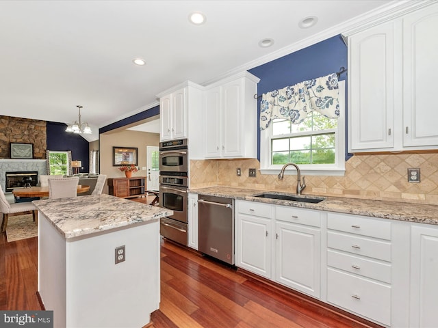 2619 Washington Way, Manchester, MD 21102 - kitchen featuring appliances with stainless steel finishes, a sink, white cabinetry, recessed lighting, and crown molding