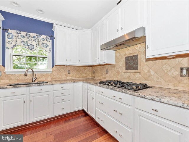 2619 Washington Way, Manchester, MD 21102 - kitchen featuring under cabinet range hood, a sink, stainless steel gas cooktop, white cabinets, and dark wood-type flooring