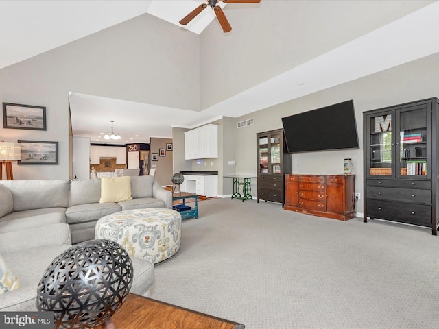 2619 Washington Way, Manchester, MD 21102 - living area with high vaulted ceiling, a ceiling fan, light carpet, a chandelier, and baseboards