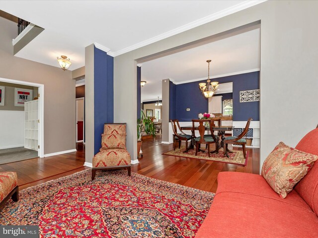 2619 Washington Way, Manchester, MD 21102 - living room with wood-type flooring, a chandelier, crown molding, and baseboards