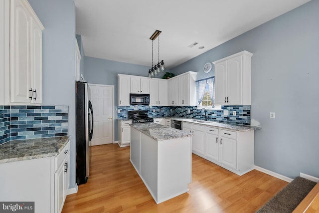 19 Pear Tree Pl, Sewell, NJ 08080 - kitchen featuring appliances with stainless steel finishes, backsplash, a sink, and white cabinetry