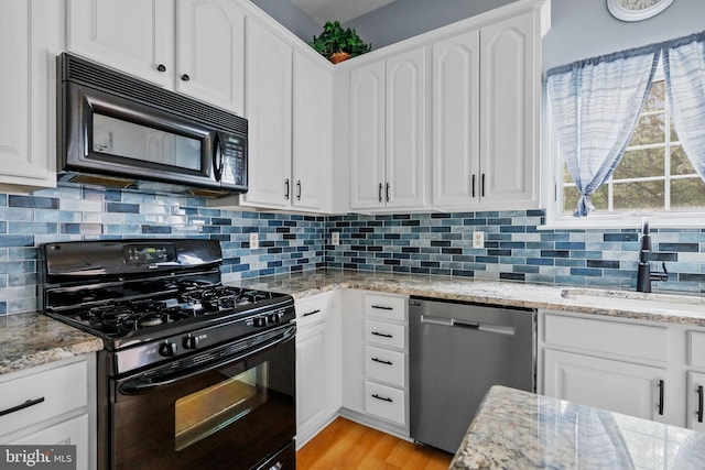 19 Pear Tree Pl, Sewell, NJ 08080 - kitchen featuring black appliances, a sink, white cabinetry, and decorative backsplash
