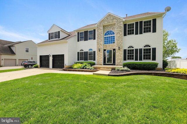 19 Pear Tree Pl, Sewell, NJ 08080 - colonial-style house with concrete driveway, a garage, and stone siding