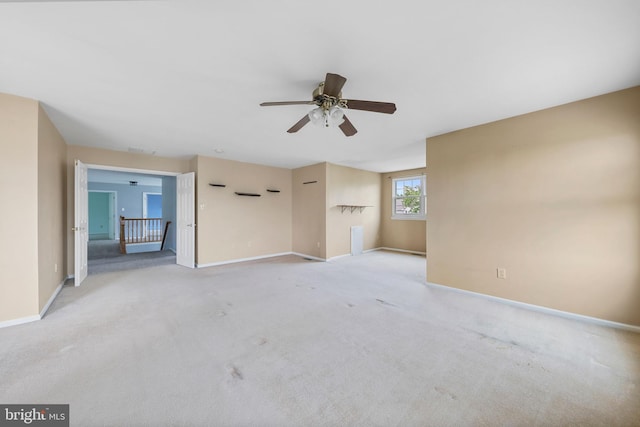 19 Pear Tree Pl, Sewell, NJ 08080 - unfurnished living room with a ceiling fan, light carpet, and baseboards