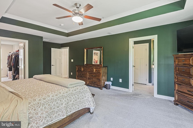 6023 Charles Henry Pl, Hanover, MD 21076 - carpeted bedroom featuring baseboards, a raised ceiling, a walk in closet, and a ceiling fan