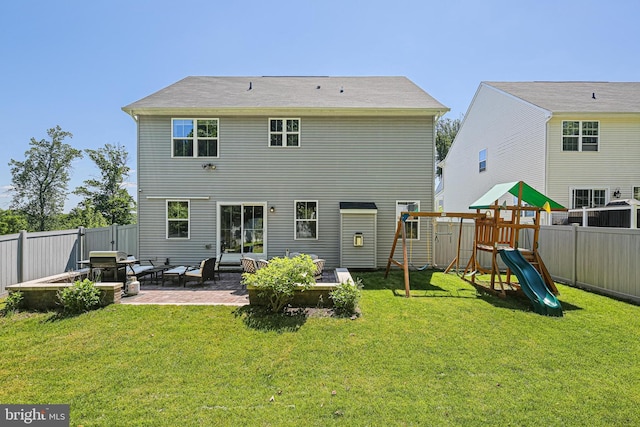 6023 Charles Henry Pl, Hanover, MD 21076 - rear view of house with a playground and a patio area