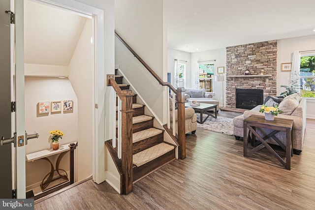 6023 Charles Henry Pl, Hanover, MD 21076 - living room featuring wood finished floors, stairs, a fireplace, and baseboards