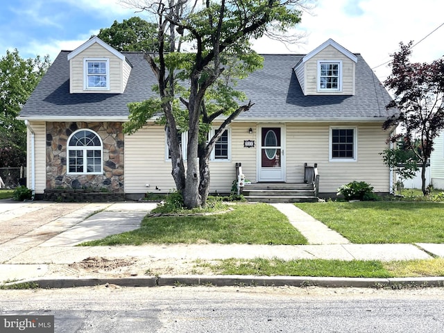 325 Jencohallo Ave, Hamilton, NJ 08619 - cape cod home featuring a front yard, roof with shingles, and stone siding
