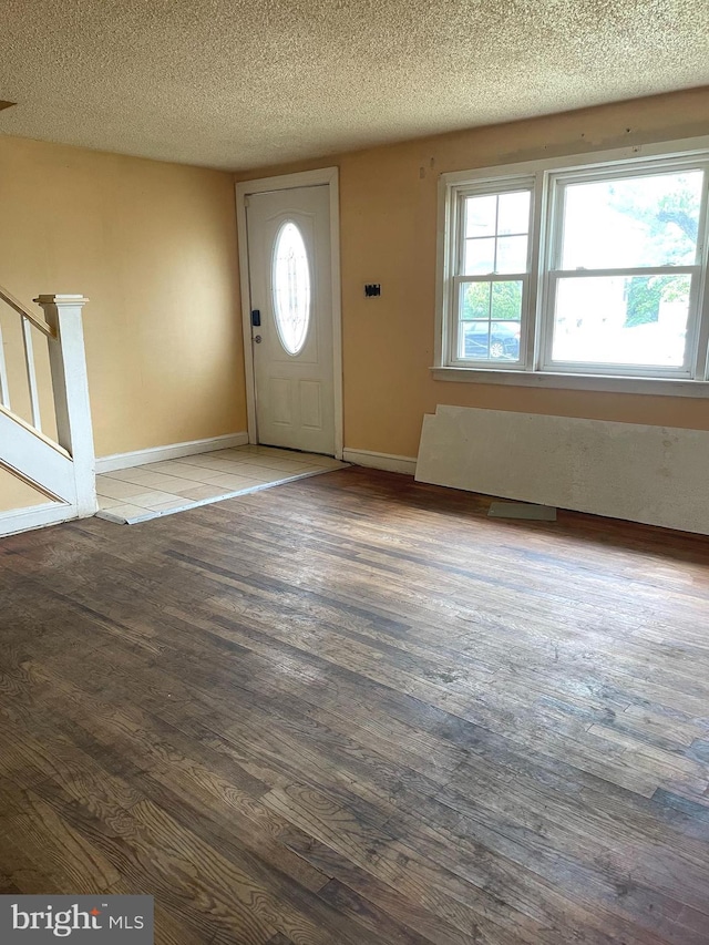325 Jencohallo Ave, Hamilton, NJ 08619 - entrance foyer with a textured ceiling, wood finished floors, stairs, and baseboards