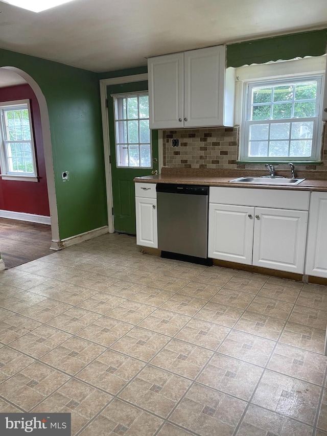 325 Jencohallo Ave, Hamilton, NJ 08619 - kitchen featuring stainless steel dishwasher, a sink, arched walkways, and healthy amount of natural light