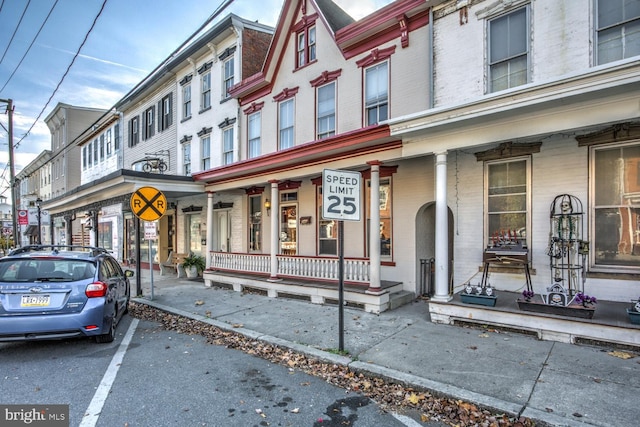 346 Main St, Denver, PA 17517 - townhome / multi-family property featuring brick siding, a porch, and uncovered parking