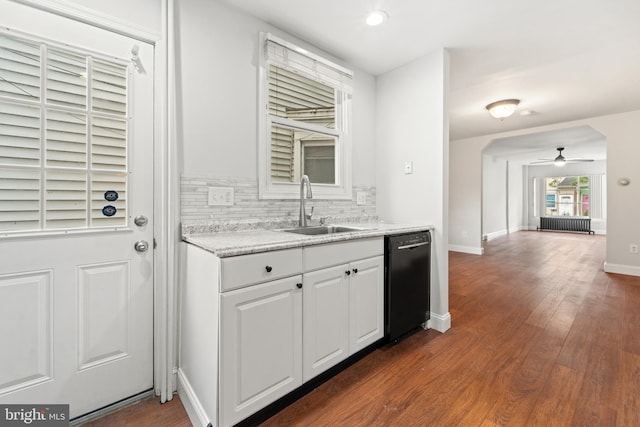 41 Bellevue Ter, Collingswood, NJ 08108 - kitchen with dishwasher, ceiling fan, radiator heating unit, tasteful backsplash, and dark wood-type flooring