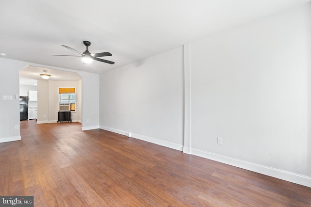 41 Bellevue Ter, Collingswood, NJ 08108 - unfurnished living room featuring radiator, ceiling fan, and wood finished floors