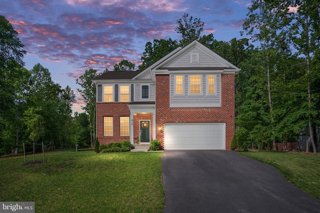 610 Long Meadow Dr, Fredericksburg, VA 22406 - view of front of home featuring asphalt driveway, an attached garage, a front yard, and brick siding