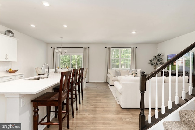 610 Long Meadow Dr, Fredericksburg, VA 22406 - living room featuring healthy amount of natural light, stairs, light wood-type flooring, and recessed lighting