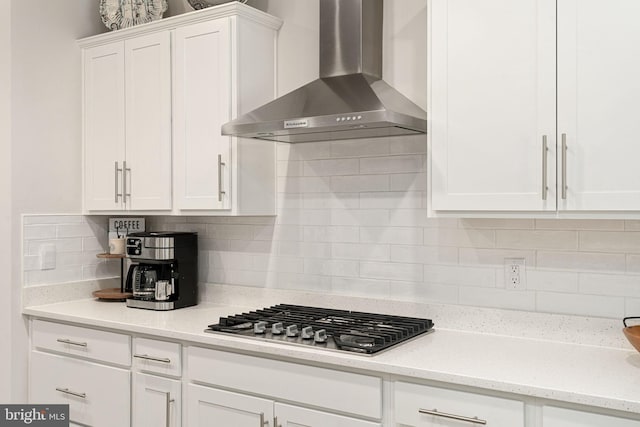 610 Long Meadow Dr, Fredericksburg, VA 22406 - kitchen featuring wall chimney range hood, stainless steel gas cooktop, white cabinets, and tasteful backsplash