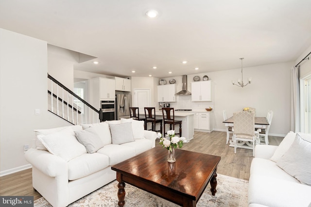 610 Long Meadow Dr, Fredericksburg, VA 22406 - living area with stairs, light wood-style floors, baseboards, a chandelier, and recessed lighting