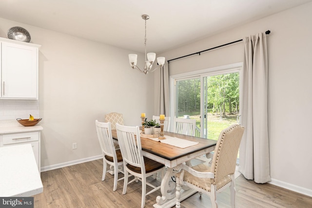 610 Long Meadow Dr, Fredericksburg, VA 22406 - dining room featuring a chandelier, light wood-style flooring, and baseboards