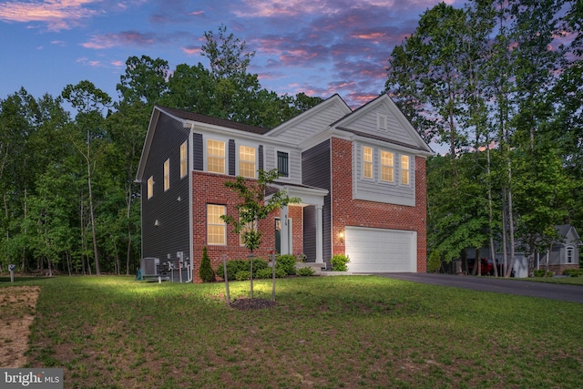 610 Long Meadow Dr, Fredericksburg, VA 22406 - traditional-style home with a garage, asphalt driveway, a lawn, and brick siding