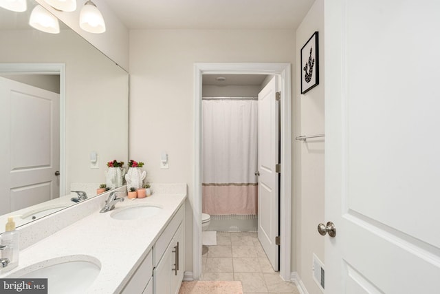 610 Long Meadow Dr, Fredericksburg, VA 22406 - bathroom featuring double vanity, toilet, marble finish floors, and curtained shower