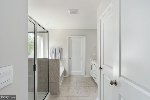 610 Long Meadow Dr, Fredericksburg, VA 22406 - full bathroom featuring a bath, vanity, a shower stall, and baseboards