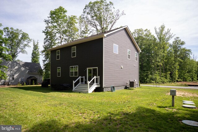 610 Long Meadow Dr, Fredericksburg, VA 22406 - rear view of house featuring central air condition unit and a yard